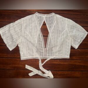 Women’s size medium/large white open back crop top